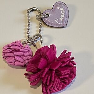 Coach Poppy Pom Pom’s and leather lavender Poppy Heart bag charm